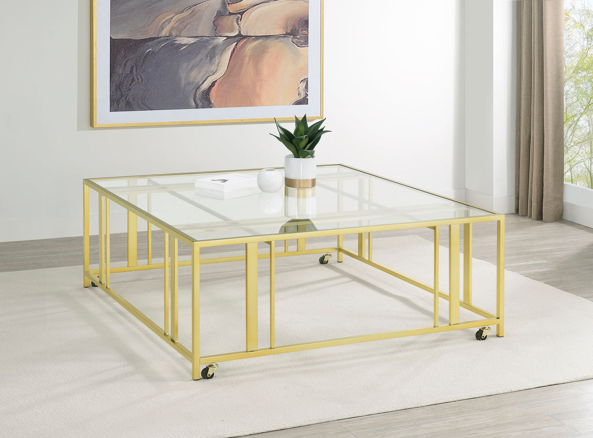 Adri Matte Brass Square Glass Top Coffee Table With Casters