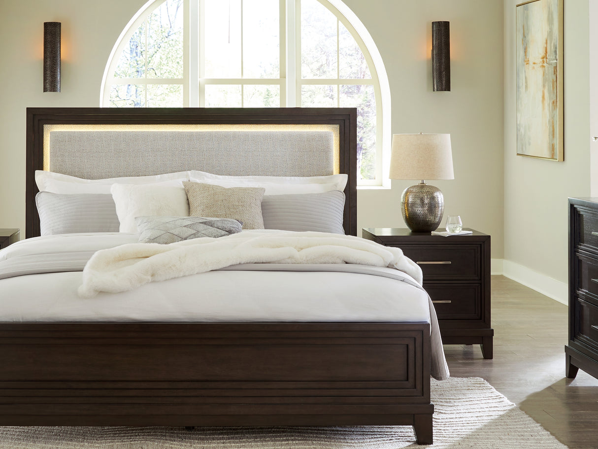 Neymorton Dark Grayish Brown Queen Upholstered Panel Bed, Dresser And Mirror