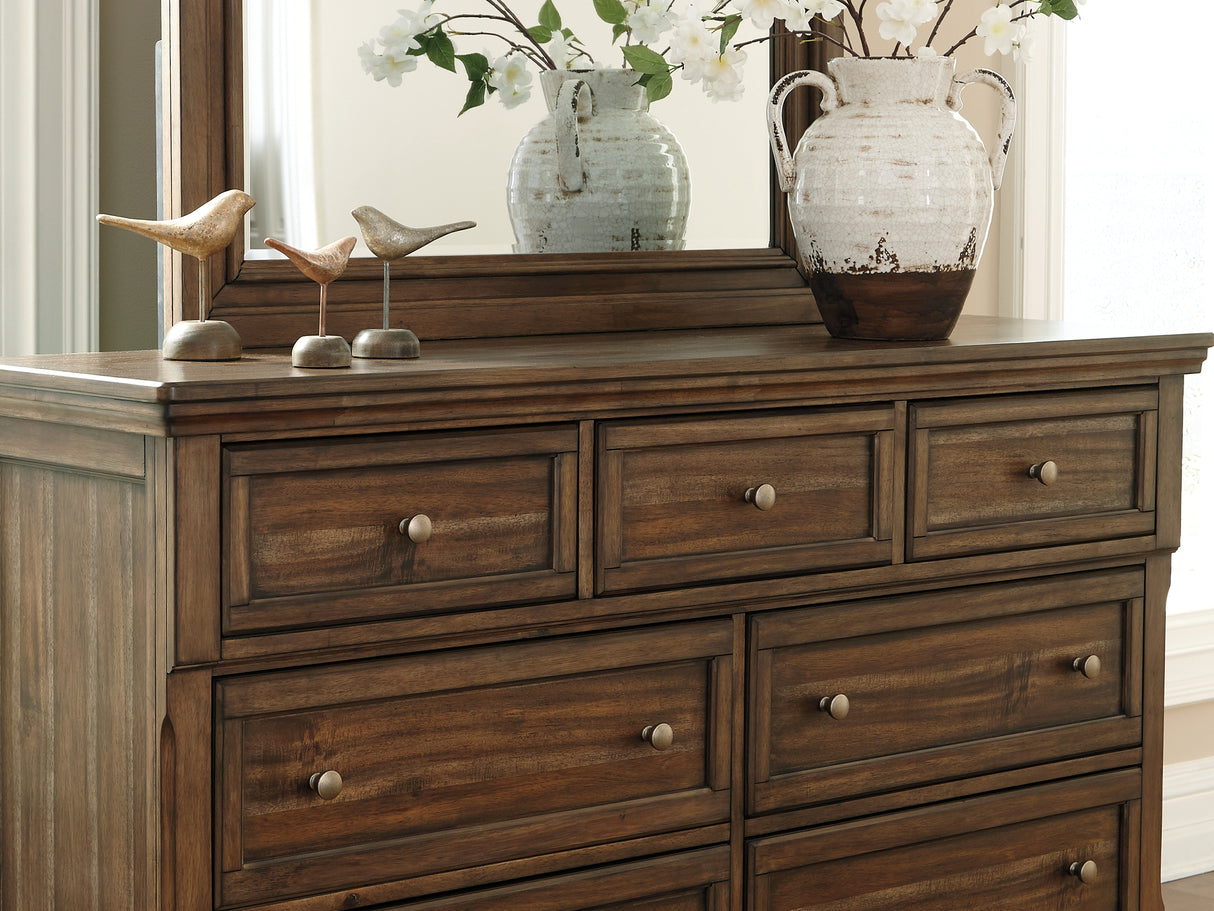 Flynnter Medium Brown King Panel Bed, Dresser, Mirror And 2 Nightstands