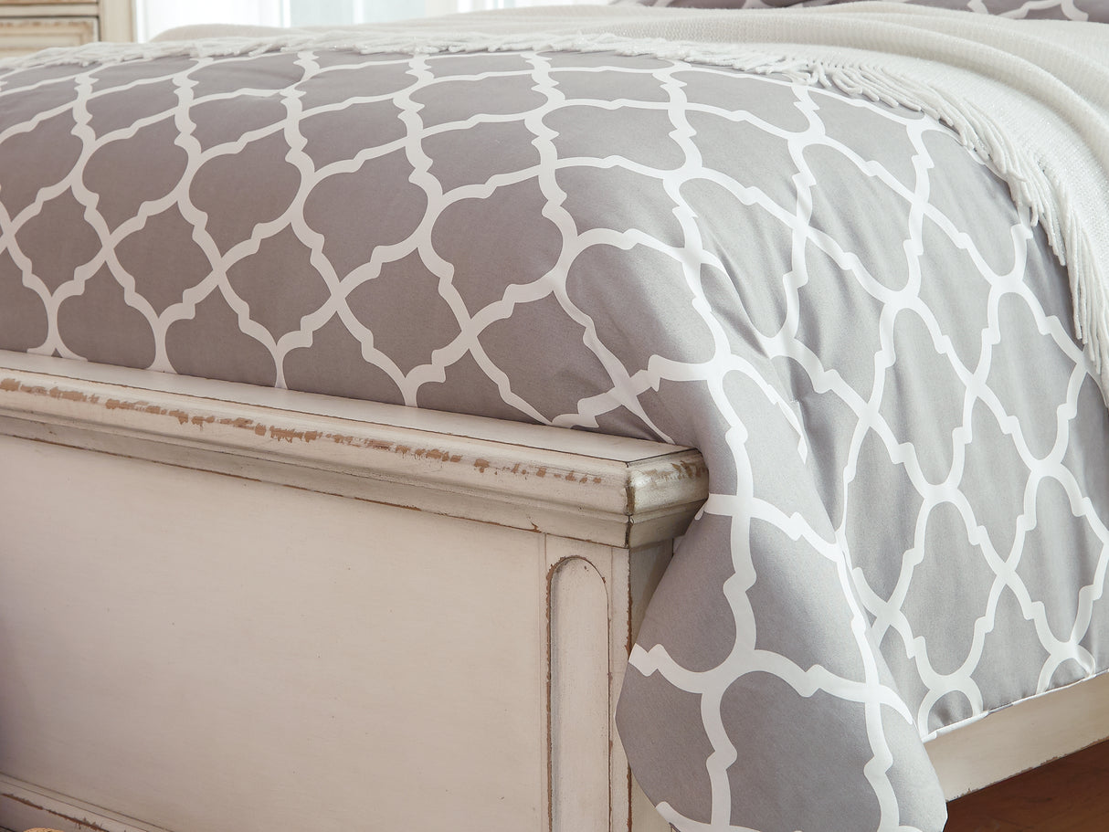 Realyn Chipped White King Upholstered Panel Bed