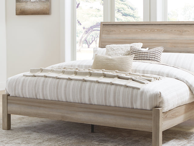 Hasbrick Tan King Panel Bed