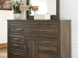 Juararo Dark Brown Queen Poster Bed, Dresser, Mirror, Chest And 2 Nightstands