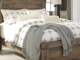 Trinell Brown Queen Panel Bed