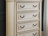 Realyn Chipped White King Panel Upholstered Bed, Dresser, Mirror And Chest