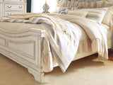 Realyn Chipped White King Upholstered Panel Bed