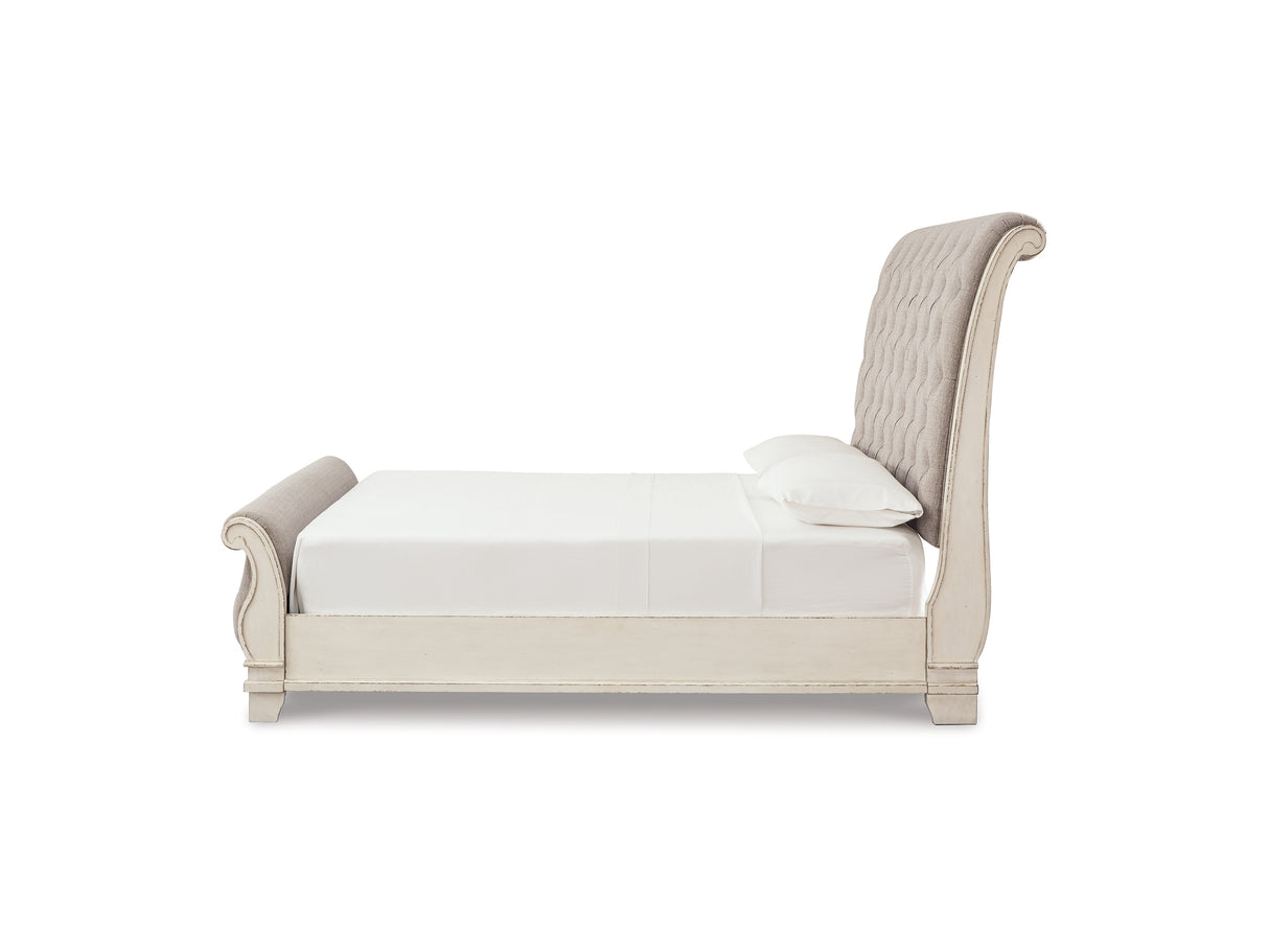 Realyn Two-Tone Queen Upholstered Sleigh Bed And Chest