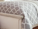 Realyn Chipped White King Upholstered Panel Bed