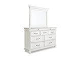 Kanwyn Whitewash Cal King Upholstered Panel Bed, Dresser, Mirror And Chest
