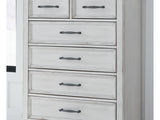 Kanwyn Whitewash Cal King Upholstered Panel Bed, Dresser, Mirror And Chest